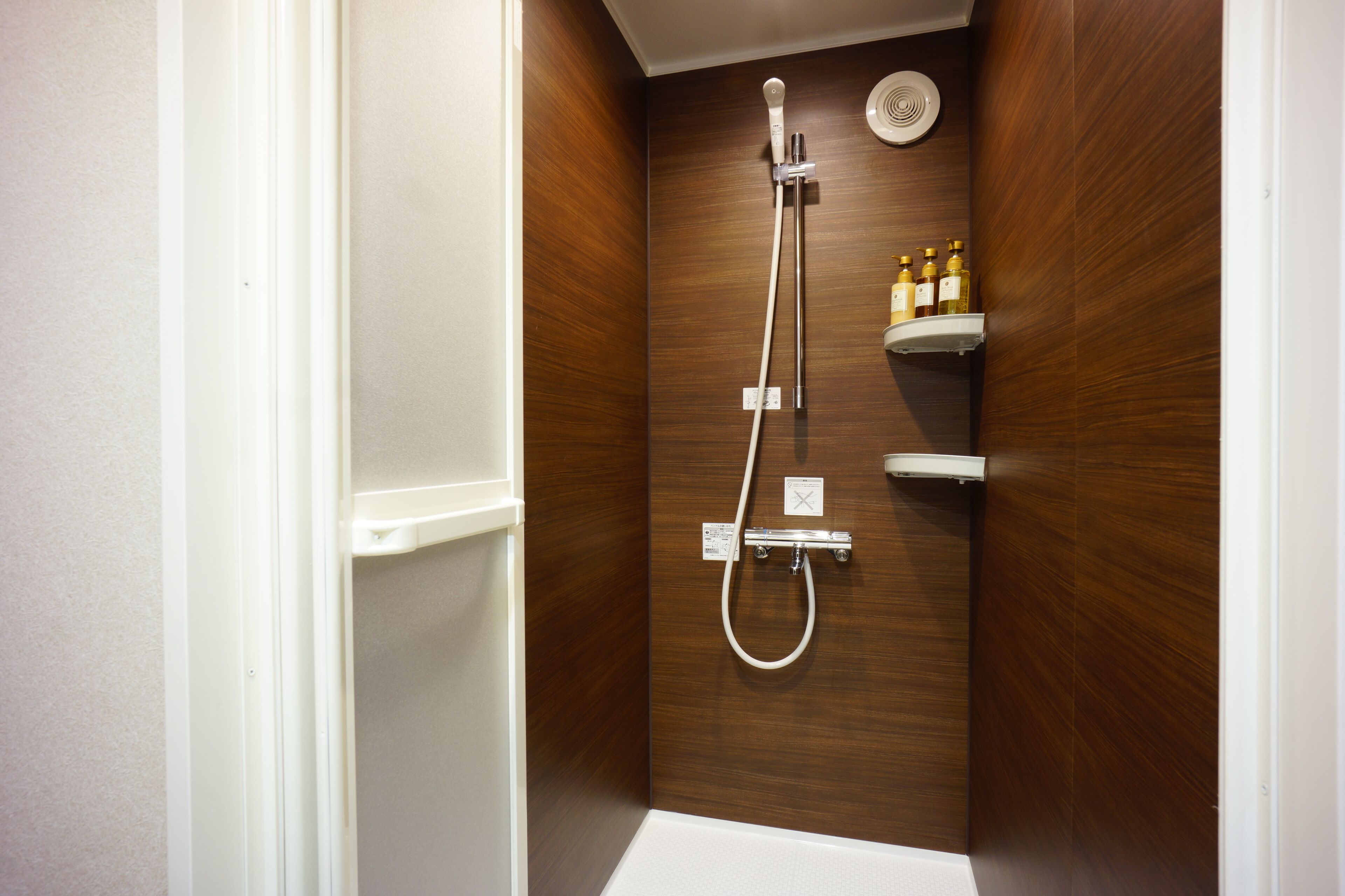 deluxe triple room | bathroom | shower, hair dryer, slippers, electronic bidet