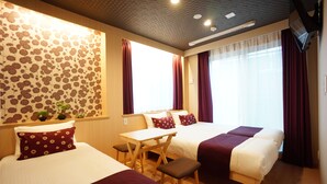 A hotel room with two beds, a desk, and a small table. - Rona Hotel (Tokyo)