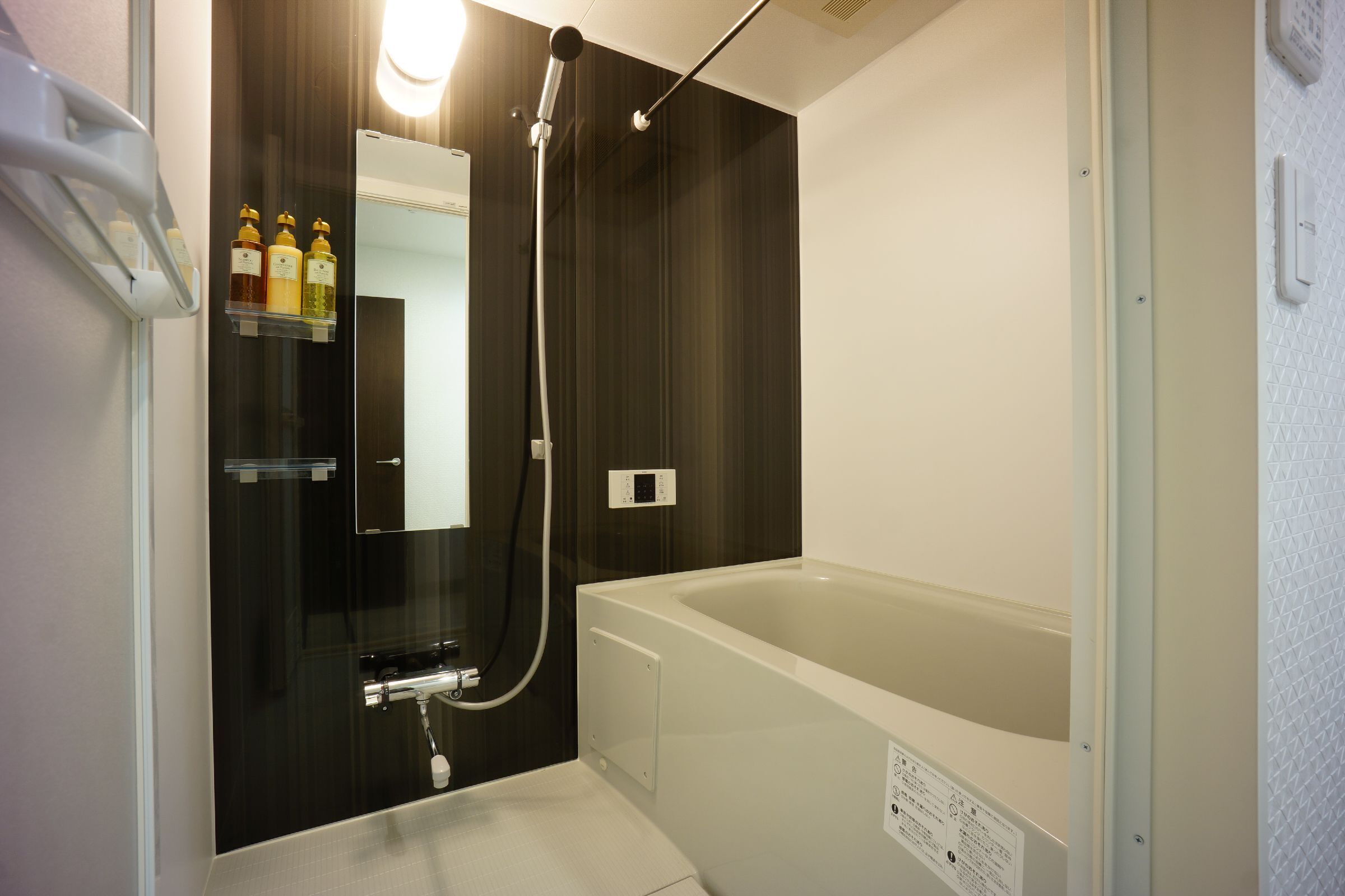 separate bathtub and shower, hair dryer, slippers, electronic bidet