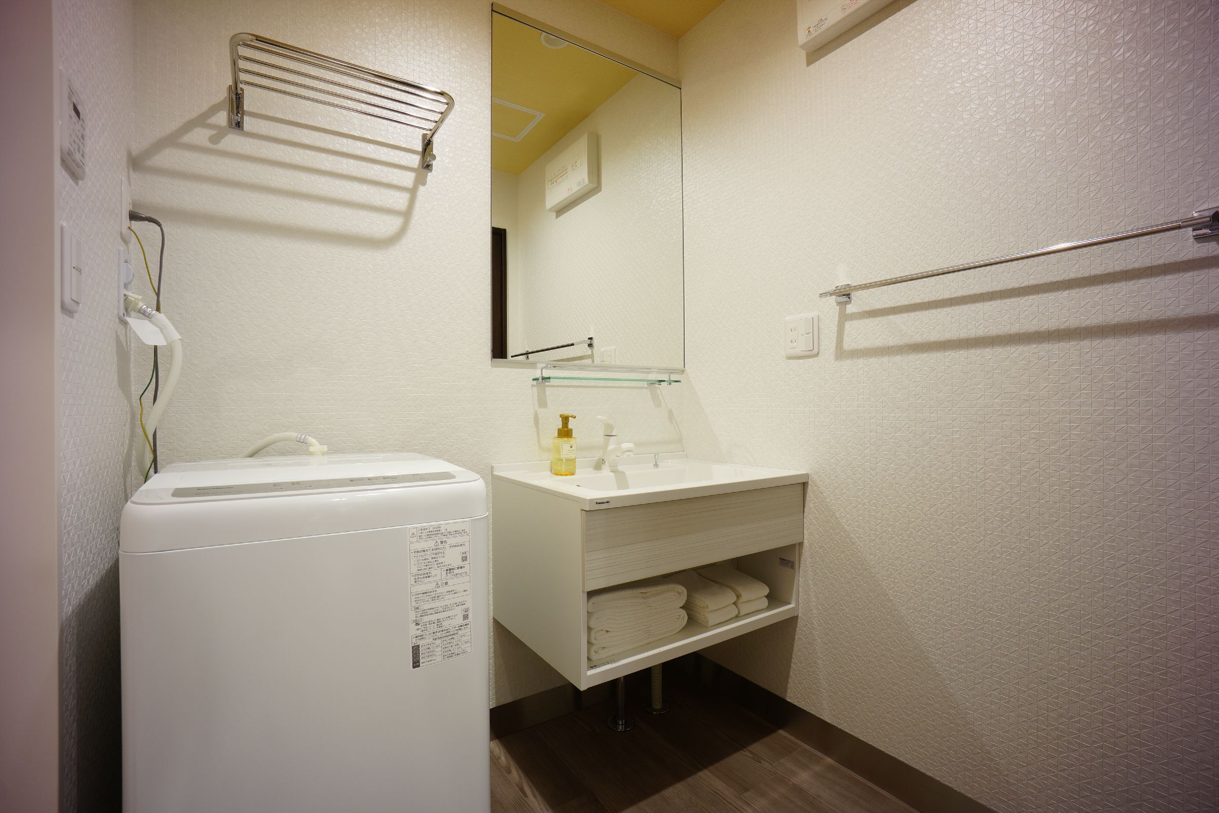 separate bathtub and shower, hair dryer, slippers, electronic bidet