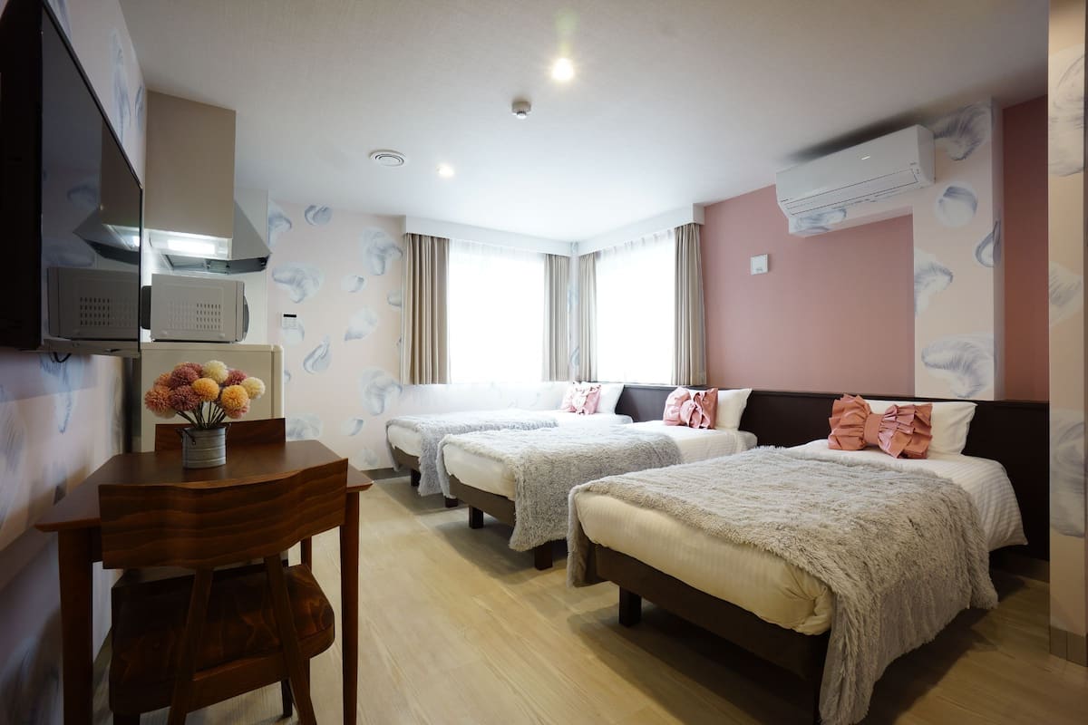 Deluxe Triple Room | Laptop workspace, iron/ironing board, free WiFi