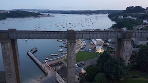 A harbor with boats, a bridge, and buildings. - Riverside retreat by Brunel’s Bridge, balcony view, off‑road parking, EV charger (Plymouth)