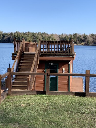 Waterfront Camp with Boathouse - Wifi, kayaks, canoe and sandy bottom out front.