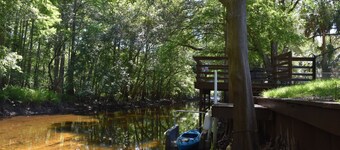 Pet safe fenced backyard on Withlacoochee River Kayaks Bikes internet provided