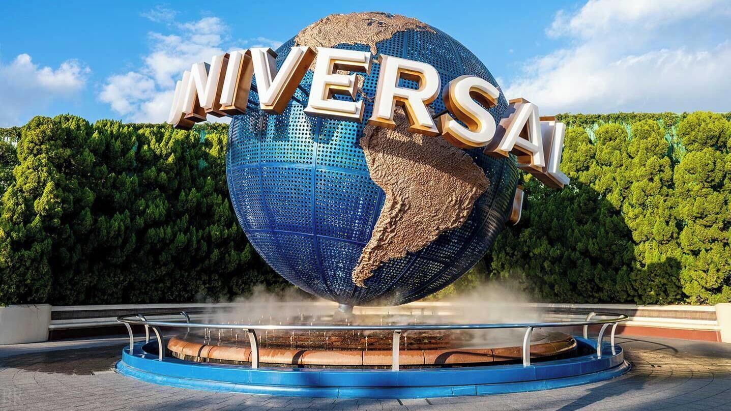 A large globe with 'UNIVERSAL' written on it, surrounded by a circular platform with railings.