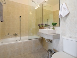Villa | Bathroom | Bathtub, hair dryer, towels