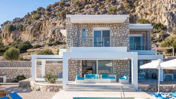 A two-story stone building with a pool and outdoor seating area. - Villa in Rhodes With Infinity Pool & BBQ (Rhodes)