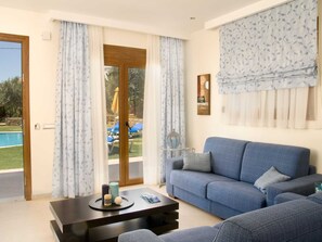 Villa | Living room | TV, fireplace, DVD player