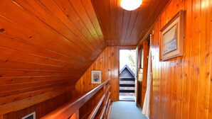 A wooden interior with a bench and a staircase leading to an outdoor area. - Restful Holiday Home in Vrbovsko (Vrbovsko)