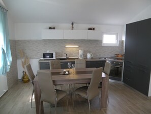 Dining - Spacious Apartment With Panoramic sea View, Shared Swimming Pool and Garden, BBQ (Tisno)