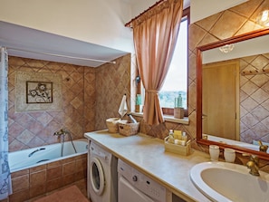 Villa | Bathroom | Combined shower/tub, hair dryer, towels