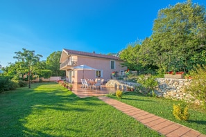 A house with a patio, a stone wall, and a garden. - Adorable Holiday Home With Private Pool & Terrace With Barbecue (Vinodol)