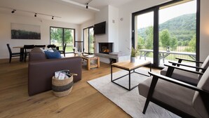 Chalet | Sala de estar | Chimenea y reproductor de DVD 