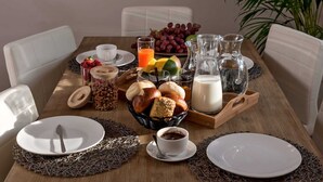 A breakfast table with bread, fruits, coffee, and milk. - Luxury Villa Lelu With Heated Saltwater Pool, Parking, High Speed Internet, Bbq, el. car Charge T2 (Split)