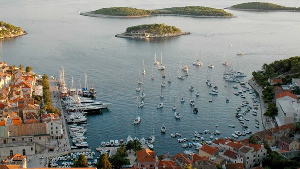 A coastal town with a marina filled with boats, surrounded by buildings with red-tiled roofs. - Luxury Villa Lelu With Heated Saltwater Pool, Parking, High Speed Internet, Bbq, el. car Charge T2 (Split)