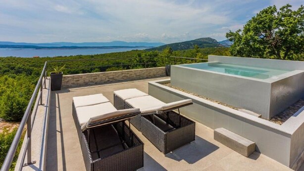 A rooftop terrace with a hot tub, lounge chairs, and a scenic view of the sea and mountains. - Holiday Home in Crikvenica With Sea View (Crikvenica)