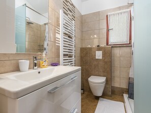 Villa | Bathroom | Shower, hair dryer, towels