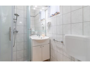 House | Bathroom | Bathtub, hair dryer, towels