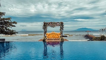 Outdoor pool, open 6:00 AM to 9:00 PM, pool loungers