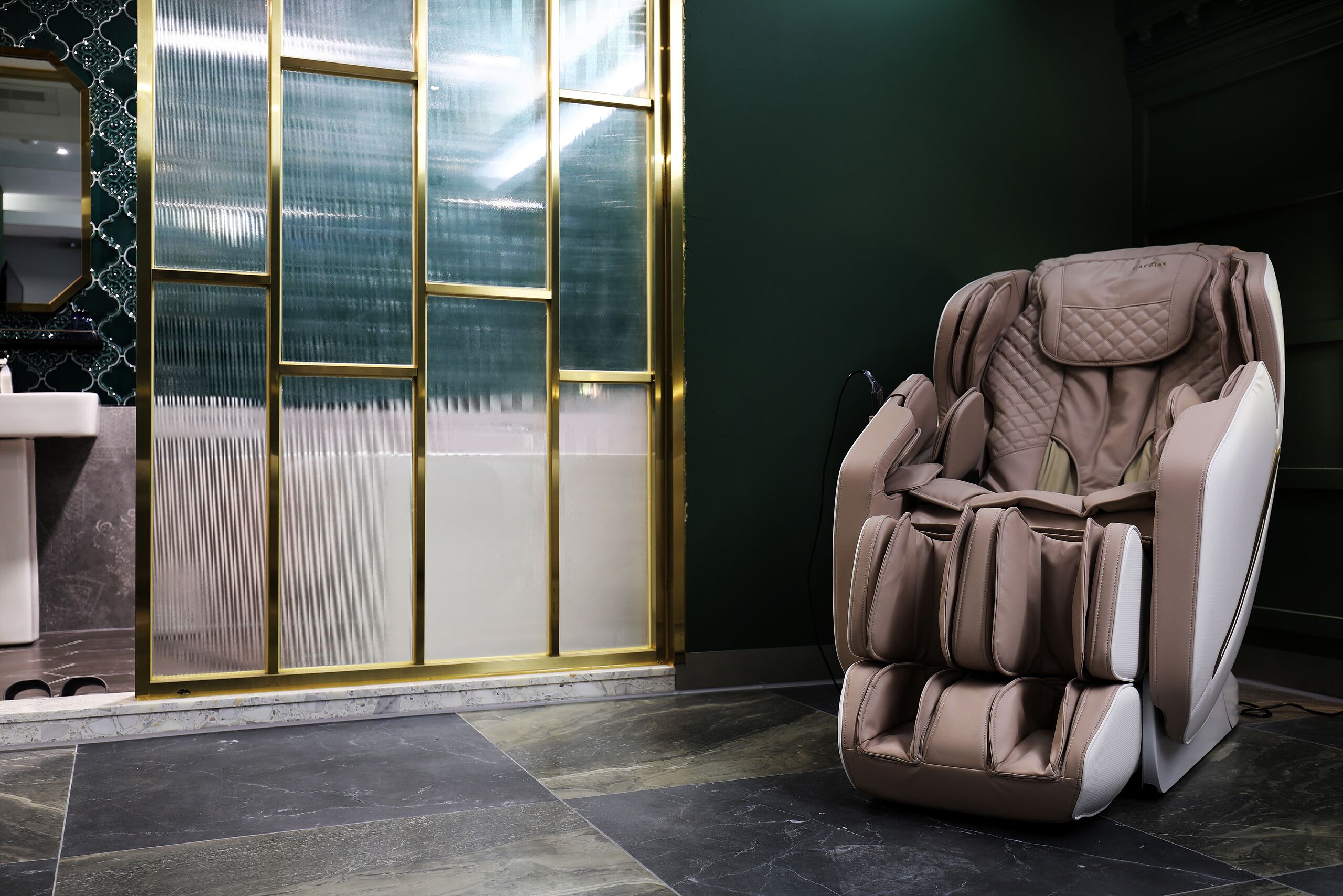 A massage chair in a room with a tiled floor and a large window with a view.