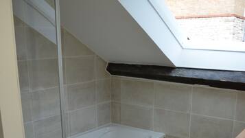 Combined shower/tub, hair dryer, towels, soap