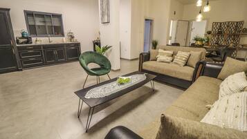 Luxury Room, Jetted Tub | Living room | 55-inch LCD TV with satellite channels, TV