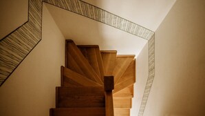 A wooden staircase with a geometric wall design. - Vineyard cottage Zdolšek (Šmarje pri Jelšah)