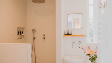 Shower, hair dryer, towels, soap