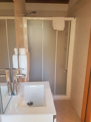 Apartment, 1 Bedroom | Bathroom | Shower, free toiletries, hair dryer, towels