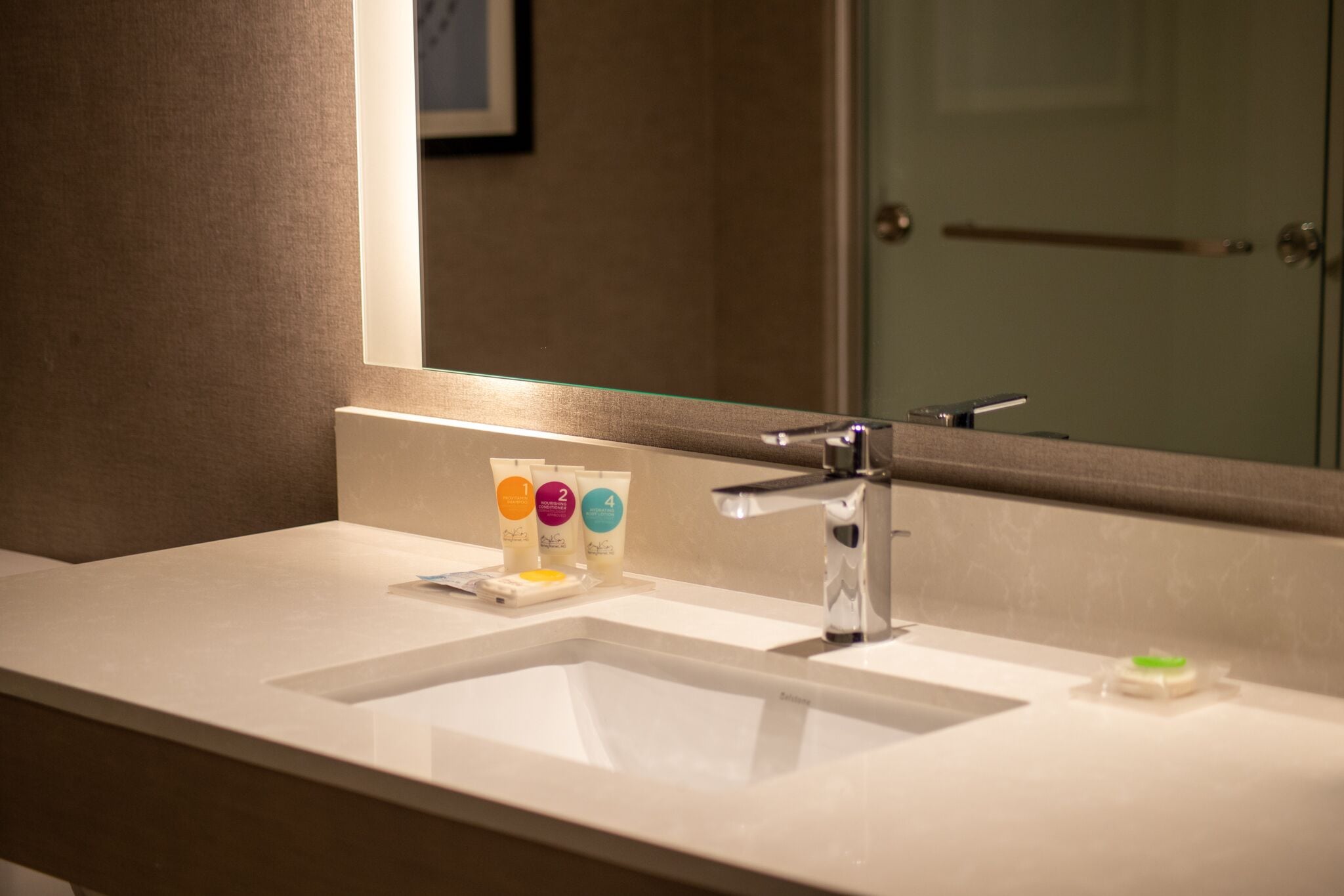 designer toiletries, hair dryer, towels