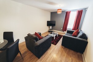 Standard Apartment | Living area | 40-inch flat-screen TV with digital channels, TV