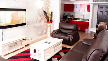 Apartamento | Zona de estar | Una televisión de pantalla plana