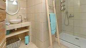 A bathroom with a sink, mirror, and shower. - privacy,  unforgettable view, crystal clear water, (Vela Luka)