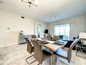 Open-Concept Dining Area with Modern Table and Patio Views - Harry Potter/ Water Fun / Console-Ready Stay (Four Corners)