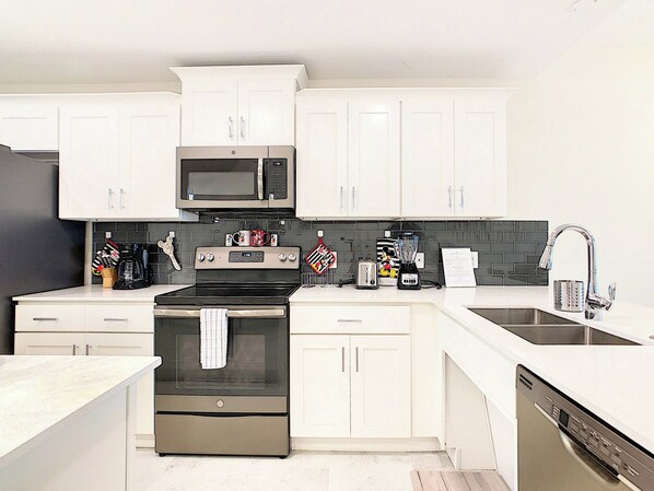 Modern Kitchen with Stainless Steel Appliances and White Cabinets
