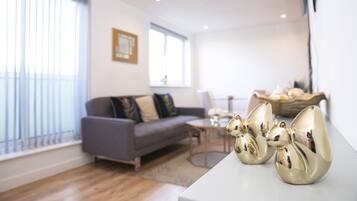 Deluxe Apartment | Living room | Flat-screen TV