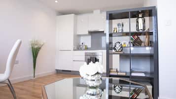 Deluxe Apartment | Living area | Flat-screen TV