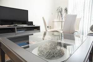 Comfort Apartment | Living area | Flat-screen TV