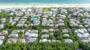 An aerial view of a coastal residential area with houses, a swimming pool, and a beach. - 2 Min Walk to the Beach, Pool + Town Square! Rosemary Family Home (Panama City Beach)