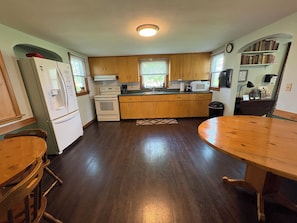Fridge, microwave, oven, stovetop - Oakridge Farmhouse at Whiterock Conservancy (Coon Rapids)
