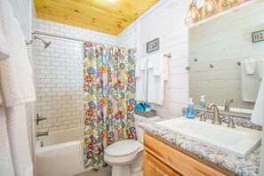 Combined shower/bathtub, hair dryer, towels, soap