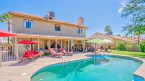 A two-story house with a swimming pool, outdoor seating, and a covered patio area. - 😎🏜️ <br>NEW Beautiful Relaxed Elegant Retreat.2330 sf 4b3b.  (Glendale)
