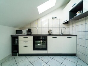 Apartment | Private kitchen | Electric kettle, toaster, cookware/dishes/utensils, dining tables - Comfortable Apartment With Balcony in a Quiet Area, Near the Beach (Zadar)