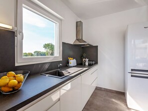 Villa | Private kitchen | Coffee/tea maker, fridge, microwave, oven