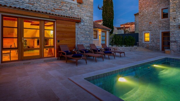 A stone building with a pool and lounge chairs. - Beautiful Villa Consisting of two Houses With Private Pool, Near Pula and Beach (Liznjan)