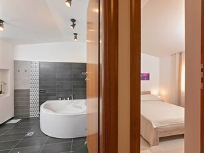 Villa | Bathroom | Bathtub, towels