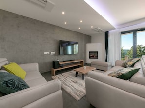 Villa | Living room | Fireplace