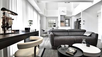 Room (Type C, 1001) | Living area | Flat-screen TV