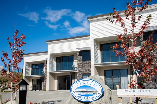 A modern building with a sign reading "Tekapo Luxury Apartments." - Tekapo Luxury Apartments (Lake Tekapo)