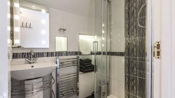 Shower, hair dryer, towels, soap